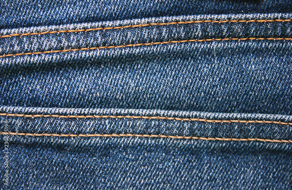 Blue Denim Jeans Texture Detail with Seam Close Up View. Classic Fashion  Jeans Natural Pattern with Borders of Many Seams. Simple Canvas of Empty Dark  Blue Denim Background for Copy Space Stock