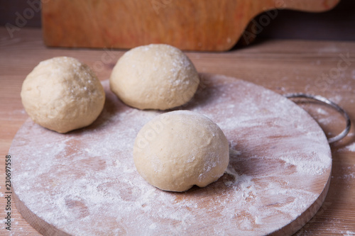 The dough is divided into three parts and formed into buns