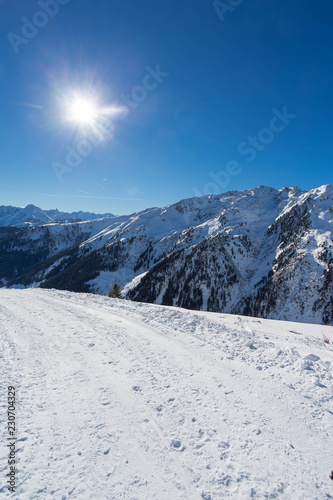Wintery mountain landscape with sunshine © fotorath