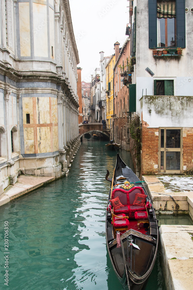 Gondola in a little canal of Venice