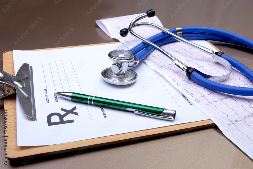 RX prescription, Red heart, asorted pils and a stethoscope on white background RX prescription, Red heart, asorted pils and a stethoscope on white background