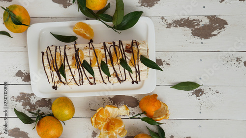 meringue roulade with cream and tangerines