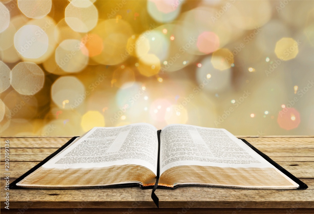 Open book on old wooden table. Open book on old wooden table.