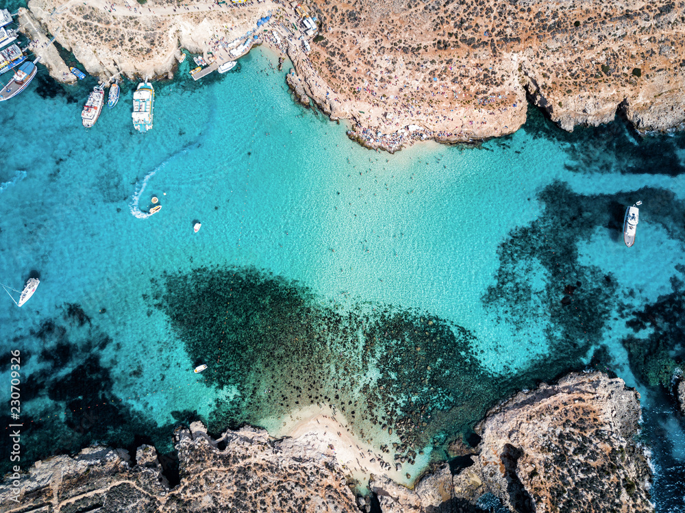 Aerial drone photo - The famous Blue Lagoon in the Mediterranean Sea. Comino Island, Malta.