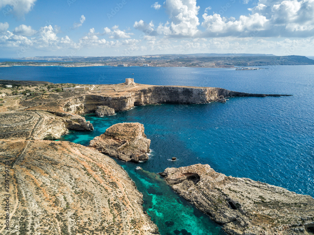 Aerial drone photo - The famous Blue Lagoon in the Mediterranean Sea.  Comino Island, Malta.     