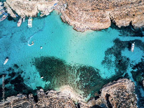 Aerial drone photo - The famous Blue Lagoon in the Mediterranean Sea. Comino Island, Malta. 