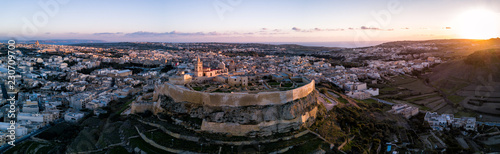 Aerial drone photo - The Gozo Citadel at sunset. A medieval fortress in the city of Victoria (Rabat). Island of Gozo, Malta.