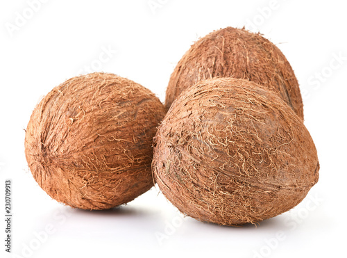 three ripe coconuts isolated on white background