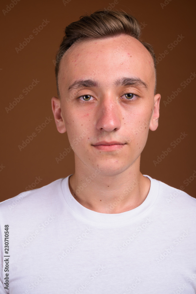 Fototapeta premium Face of young handsome man with blond hair