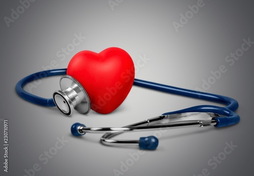 Medical Stethoscope with plastic Heart on wooden