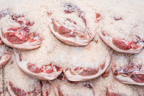 Salting process of iberian ham. Meat industry concept.