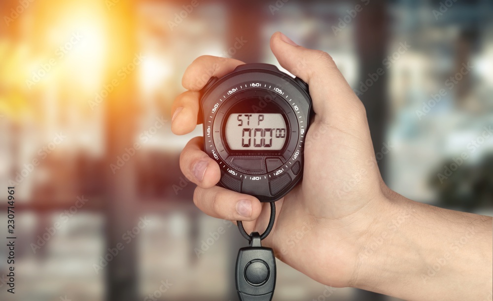 Fototapeta premium Man hand holding stopwatch