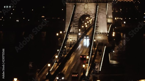 Traffic on Sz√©chenyi Chain bridge over Danube river, Budapest city, Hungary. Night scene photo