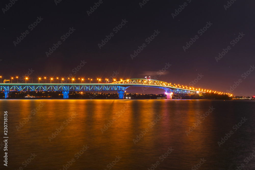 Fototapeta premium Night View to the Iconic Harbour Bridge Auckland New Zeland; Light Performance