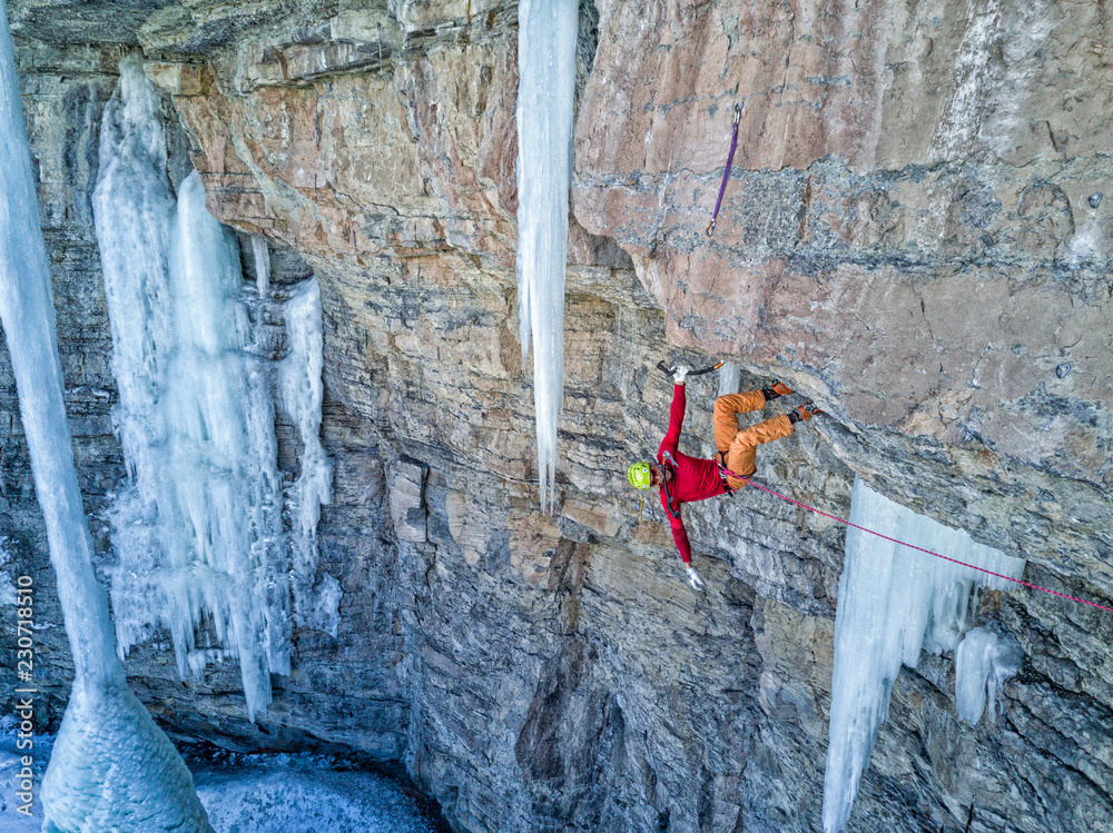 Skilled ice/mixed climber on the rock walls of the East Vail Amphitheater