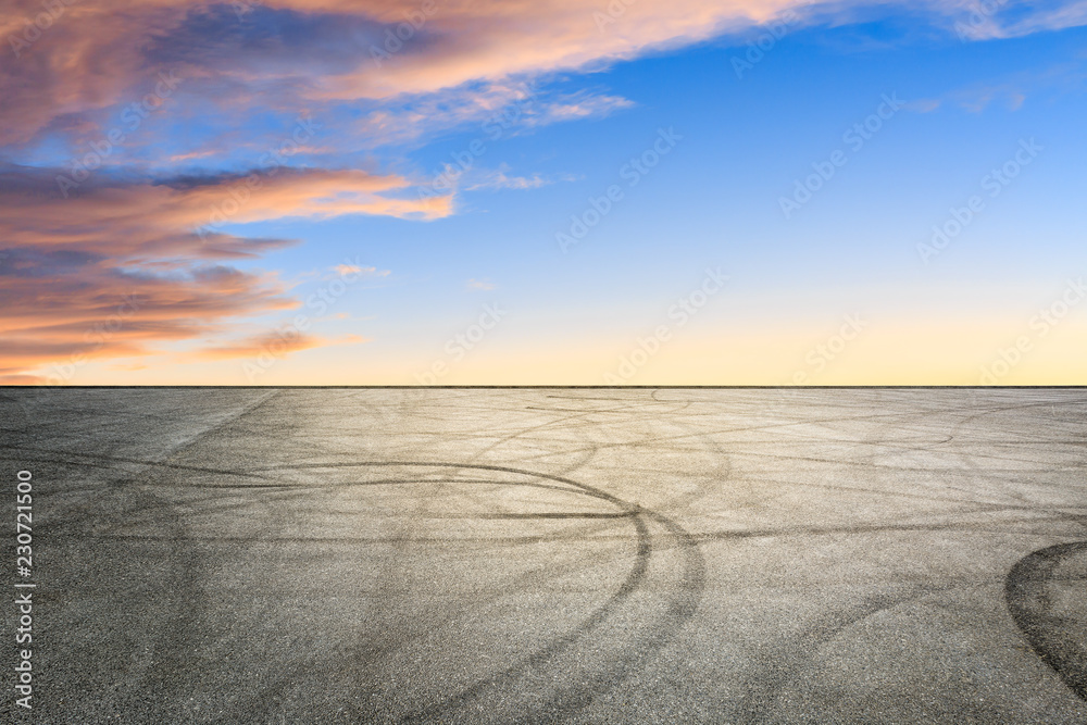 Fototapeta premium Car track square and sky beautiful cloud scenery at sunset