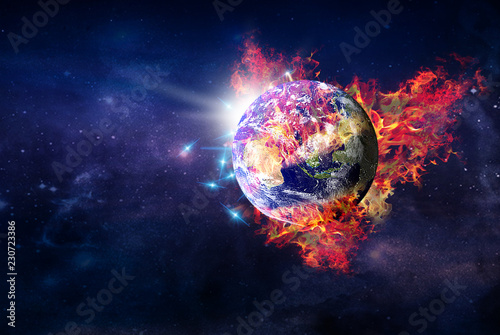 flying burning globe planet Earth in outer space.elements of this image furnished by NASA