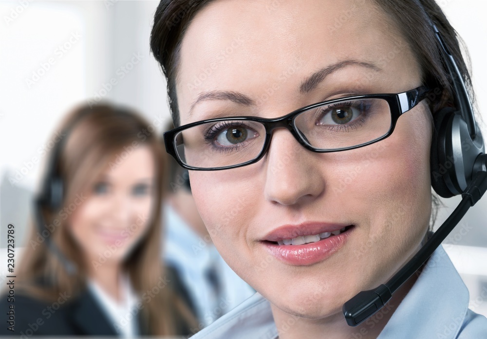 Young woman with headphones, call center or