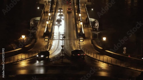 Traffic on Sz√©chenyi Chain bridge over Danube river, Budapest city, Hungary. Night scene photo