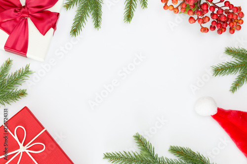 Top view of Christmas composition, gift box, pine cones, fir branches on white background and copy space for text information © comzeal