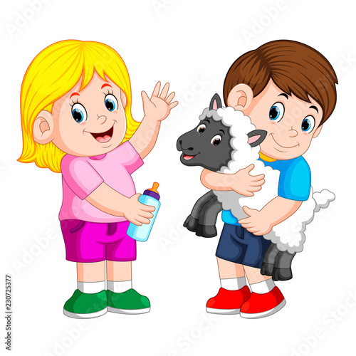 young girl holding baby milk bottle and boy plays with sheep