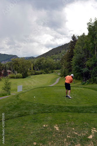 Golfer teeing off in Vail Colorado