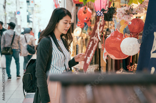 woman enjoy the beauty of the lantern shop. photo