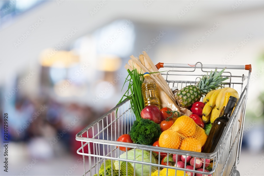 Shopping cart filled with various groceries