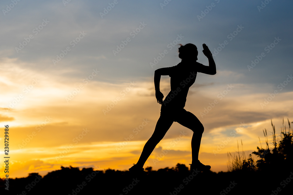 silhouette woman running alone at beautiful sunset in the park. silhouette woman running alone at beautiful sunset in the park.