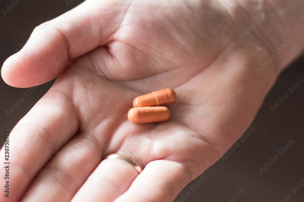 pills in a man's palm pills in a man's palm