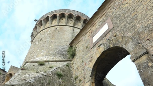 Gate of ancient Fortezza Medicea, medieval fortress in Volterra, Tuscany, Italy. Beautiful old building of middle age built by Lorenzo Il Magnifico. Italian holiday, sightseeing, tourism destination