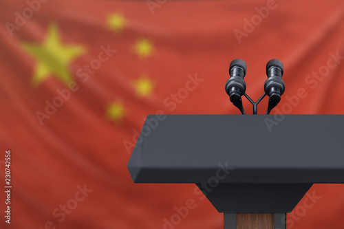 Photography Podium lectern with two microphones and China flag in background
