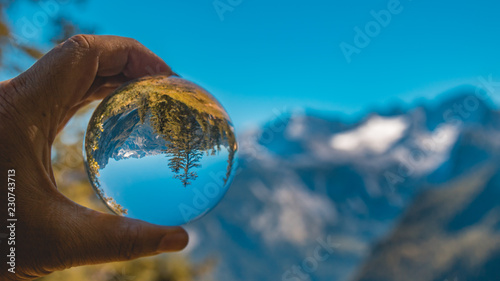 Crystal ball alpine landscape shot at the famous Gosauaee-Salzburg-Austria