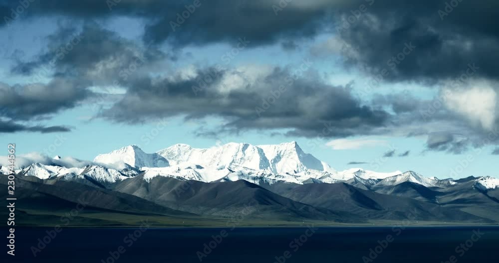 4k time lapse of huge clouds mass rolling over lake namtso & Tanggula snow mountain peak,tibet mansarovar,Tibet's second largest lake,is the third largest saltwater lake in China,xizang Plateau