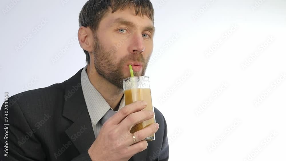 bearded businessman having healthy lunch, guy drinks vegetable smoothies. slow motion bearded businessman having healthy lunch, guy drinks vegetable smoothies. slow motion