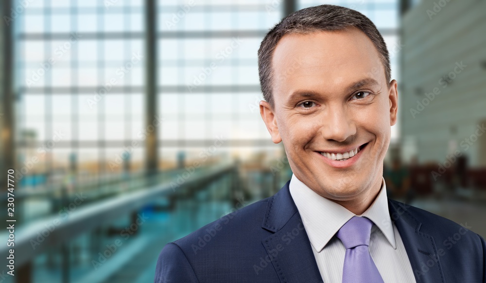 Portrait of happy businessman on background Portrait of happy businessman on background
