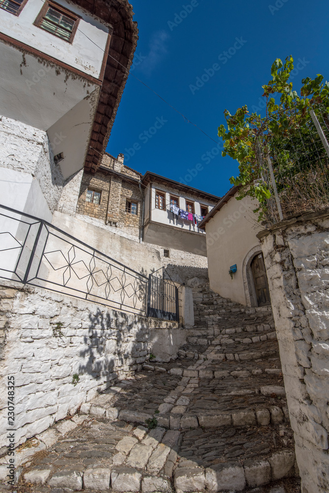 Obraz premium Old town Berat, historic city in the south of Albania.Tiny stone streets with white stone houses built in ottoman style. also called city of a thousand windows. World Heritage Site by UNESCO