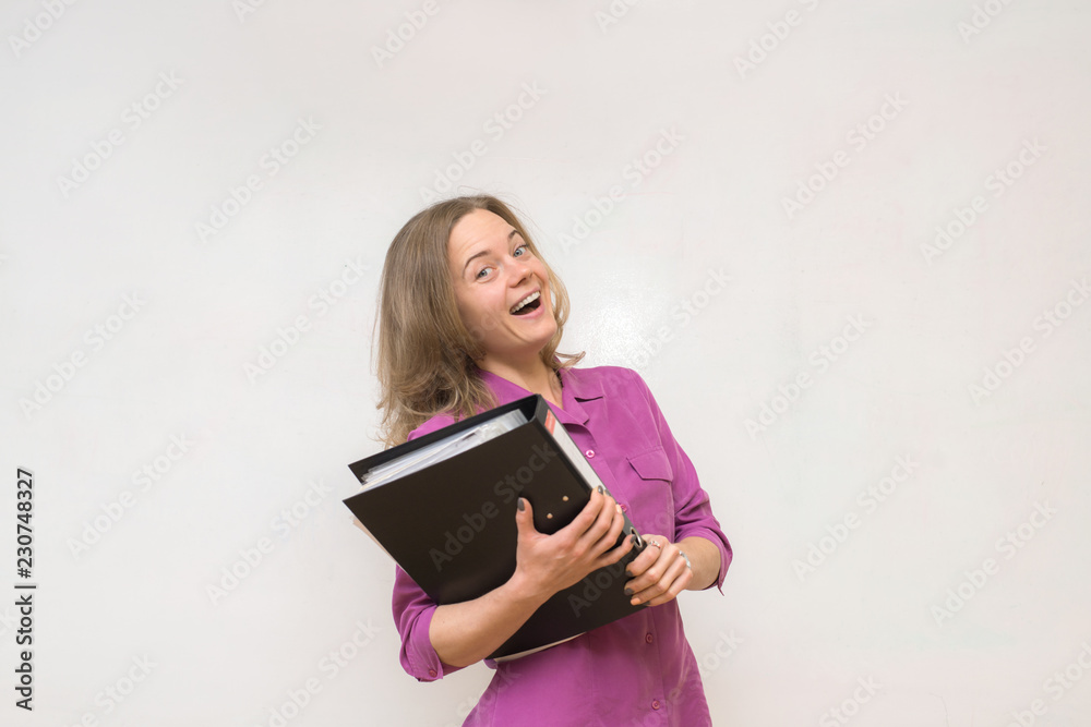 Happy girl is holding a folder with documents Happy girl is holding a folder with documents