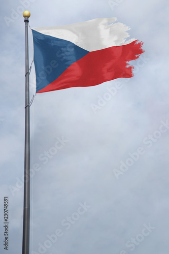 Worn and tattered Czech Republic flag blowing in the wind on a cloudy day