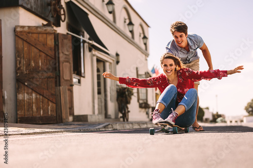 Woman enjoying a skateboard ride on the street
