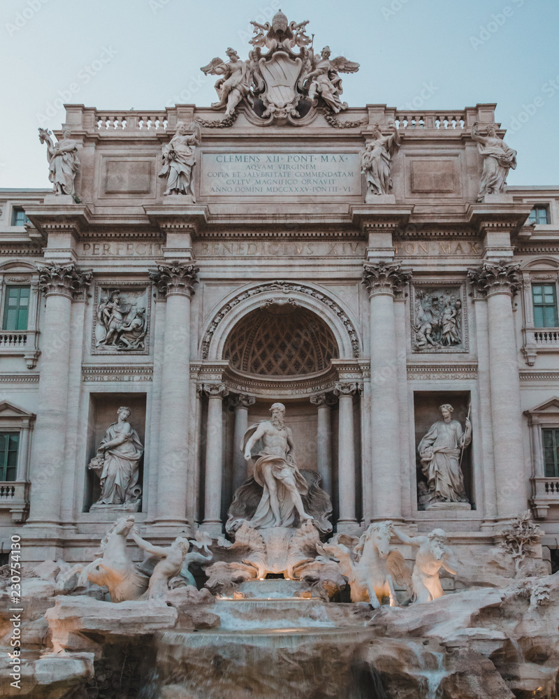 Amazing Trevi Fountain ( Fontana di Trevi ) at sunset. Baroque fountain designed by architect Nicola Salvi and completed by Pietro Bracci. One of the most famous fountains in the world. Rome. Italy