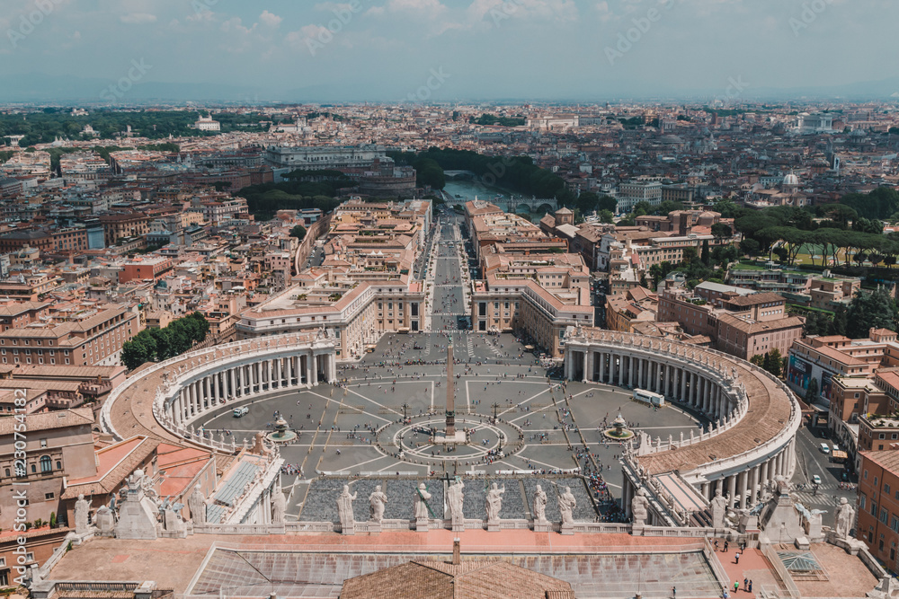Saint Peters Square in the Vatican and an aerial view of the rooftops of Rome, Italy in a travel and tourism concept