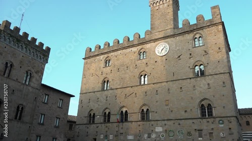 Pan of Palace of Priors in Volterra, Tuscany, Italy, Italian tourism destination. View of Palazzo dei Priori in main square, famous medieval building, beautiful attraction. Visiting Tuscan landmark