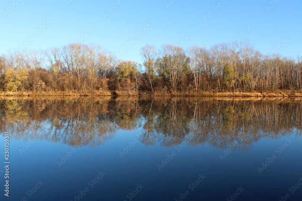 Autumn landscape with reflection of trees in the river Autumn landscape with reflection of trees in the river