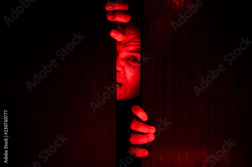 Man trying to get out of / Claustrophobia concept photo
