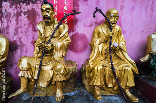 Two gold painted Buddhas on the pathway to Ten Thousand Buddhas Monastery, Hong Kong, Sha Tin, New Territories