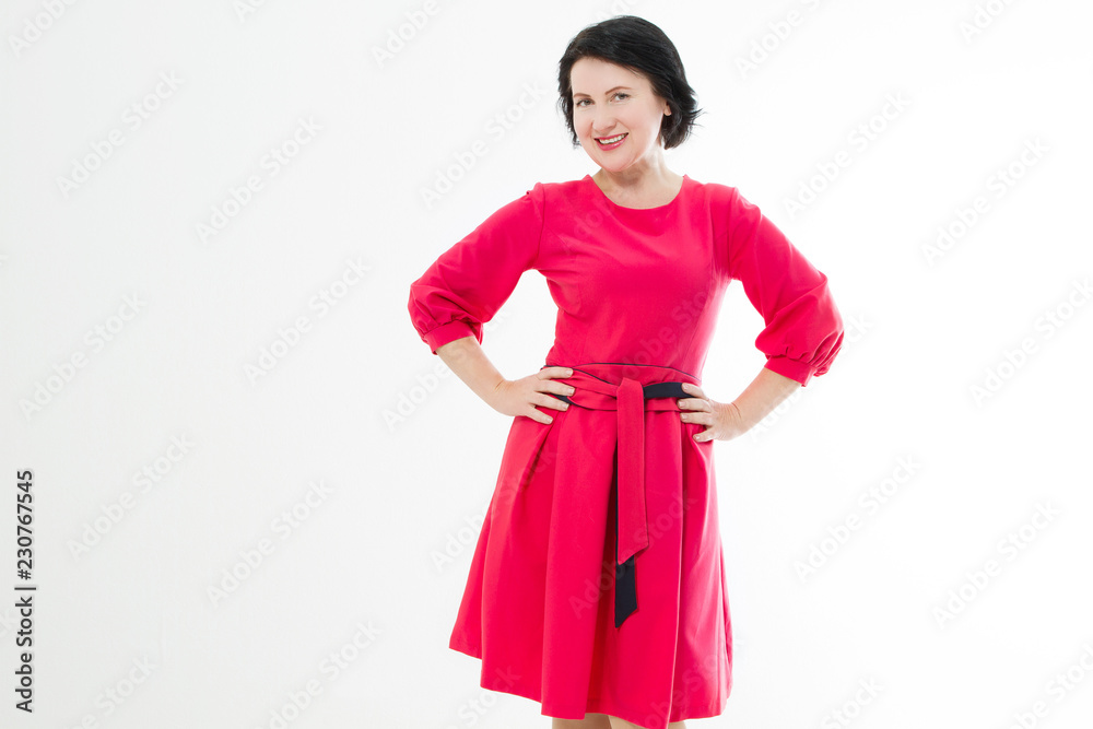 Happy middle age woman in fashion red dress with make up isolated on white background. Copy space