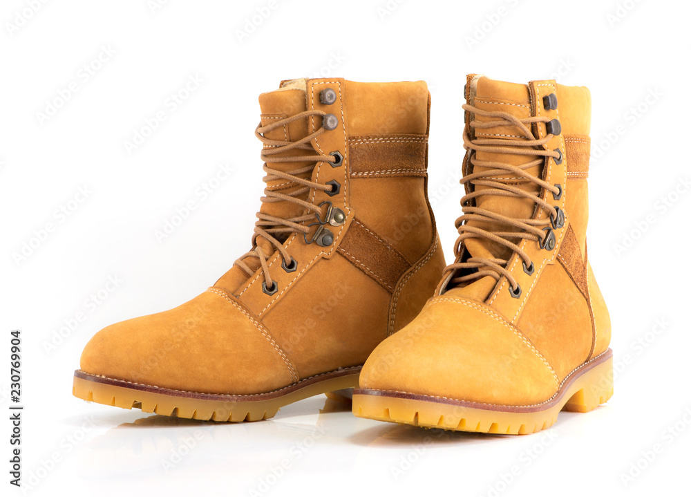 Yellow nubuck men’s boot for winnter collection isolated on white background. Fashion advertising boot photos. Yellow nubuck men’s boot for winnter collection isolated on white background. Fashion advertising boot photos.