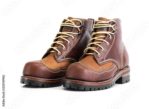 Brown oil full grain men’s boot with steel toe for biker isolated on white background. Fashion advertising boot photos.