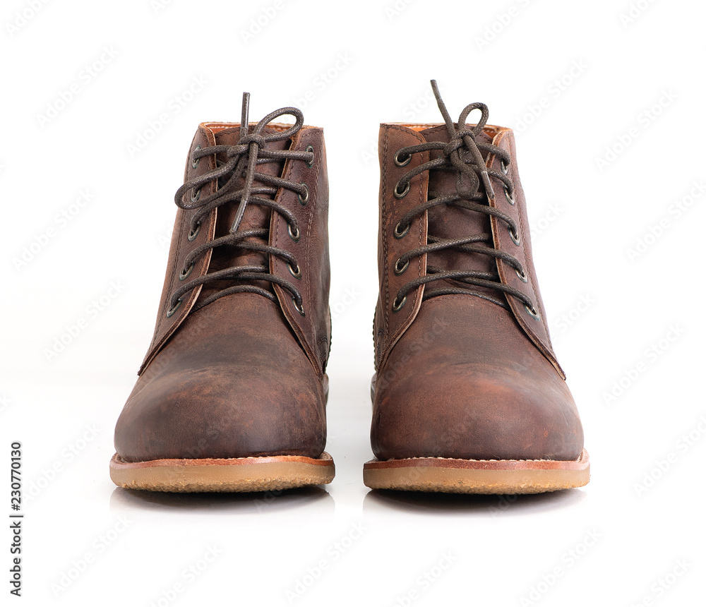 Brown oil full grain men’s ankle boot with steel toe for biker isolated on white background. Fashion advertising photos.